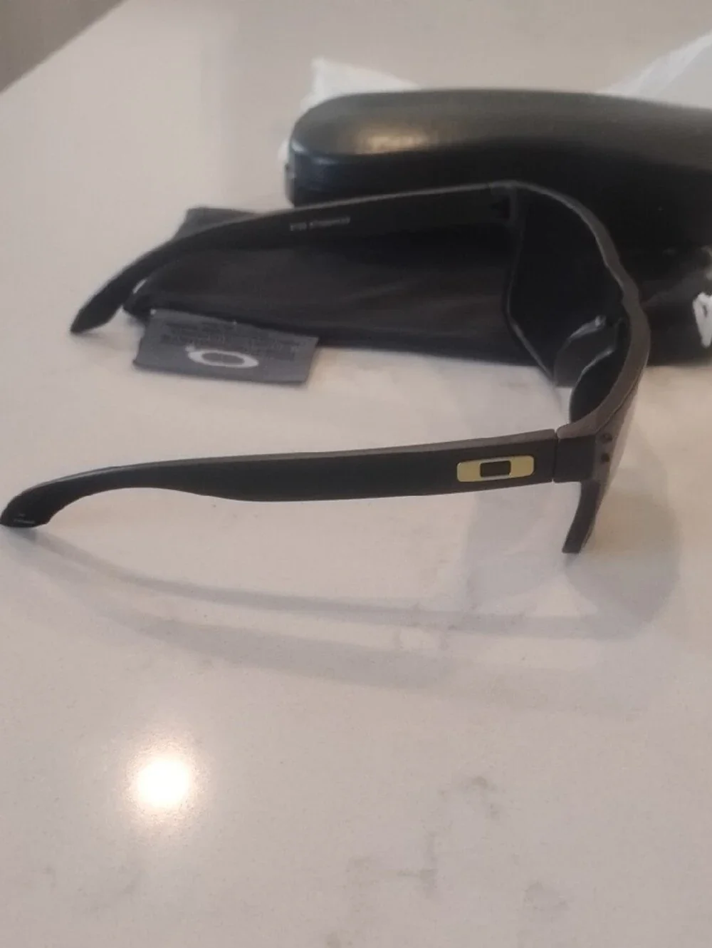 Oakley Matte Black Sunglasses with Yellow-Orange Mirror Lenses